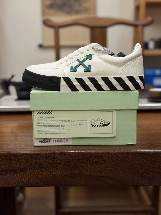 Off-White CO Virgil Abloh Vulc Low Top Arrow Low-Top Vulcanized Canvas Sneakers.