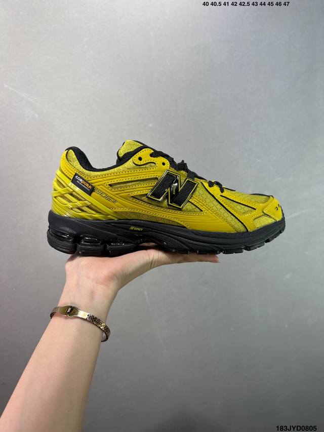 A corporate-grade New Balance M1906 retro piece, a treasured dad shoe. This cor