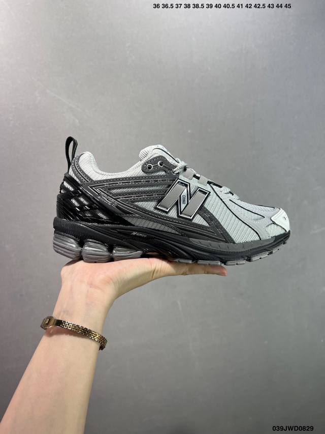 A corporate-grade New Balance M1906 retro piece, a treasured dad shoe. This cor