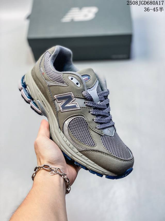 New Balance 2002R running shoes are thick-soled dad shoes for men and women. Th