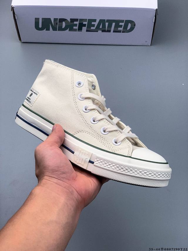 For the high-low, Undefeated has the classic mid-top shoe. Classic Converse onc