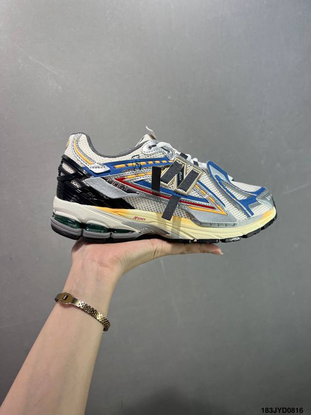 A corporate-grade New Balance M1906 retro piece, a treasured dad shoe. This cor