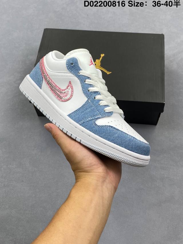 The Air Jordan 1 Low in blue, white, and pink denim features white leather with