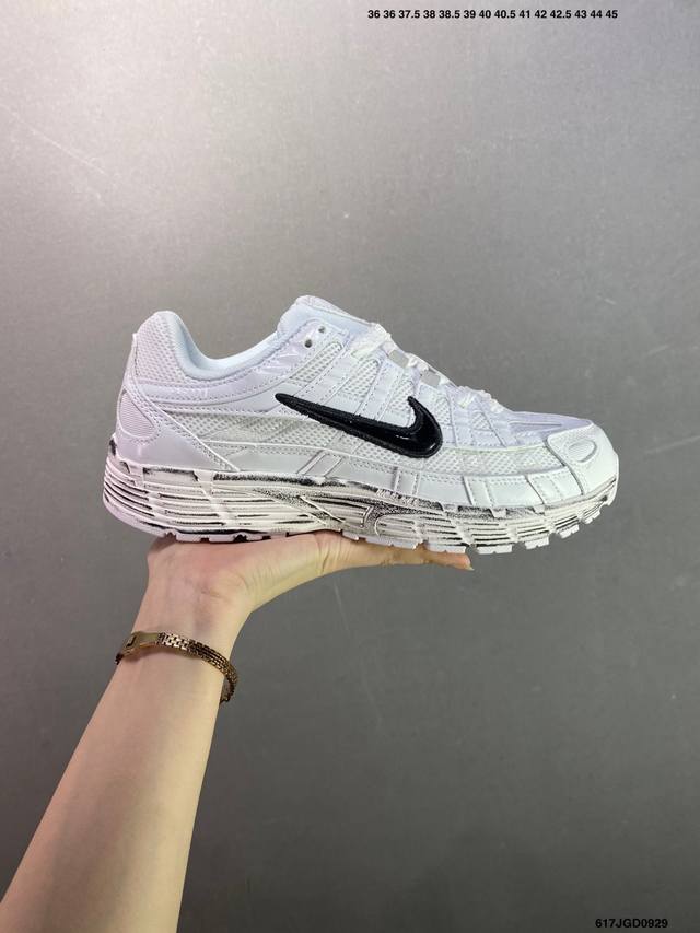 The Nike P-6000 running shoe features red hooks on both the inside and outside.