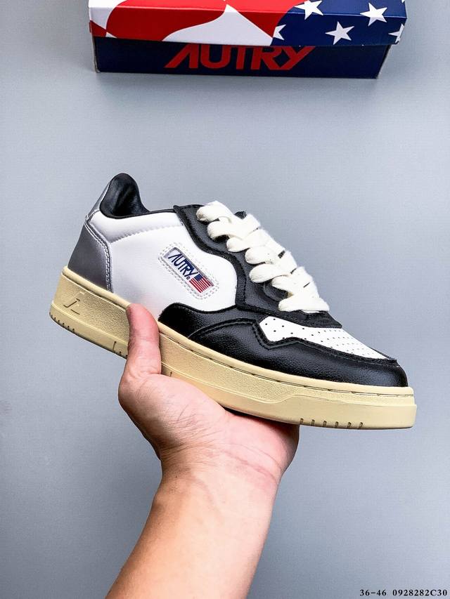 Autry Medalist Suede And Leather Low, a classic, versatile casual sneaker from t