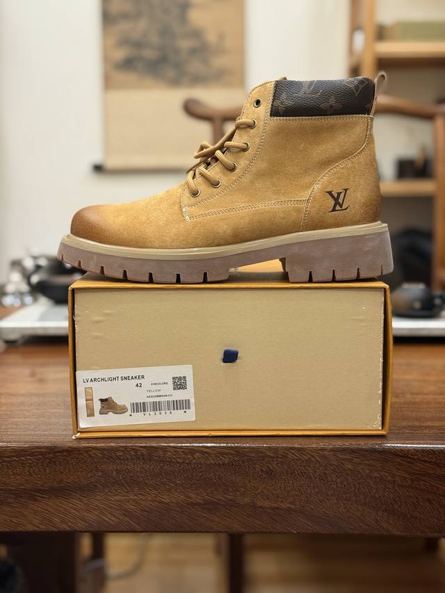 The Lv x Timberland Lv collaboration features a luxurious, high-end yellow boot,