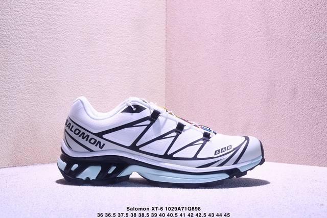 Company-grade Salomon XT-6 outdoor trail running shoes. The upper features Sensi