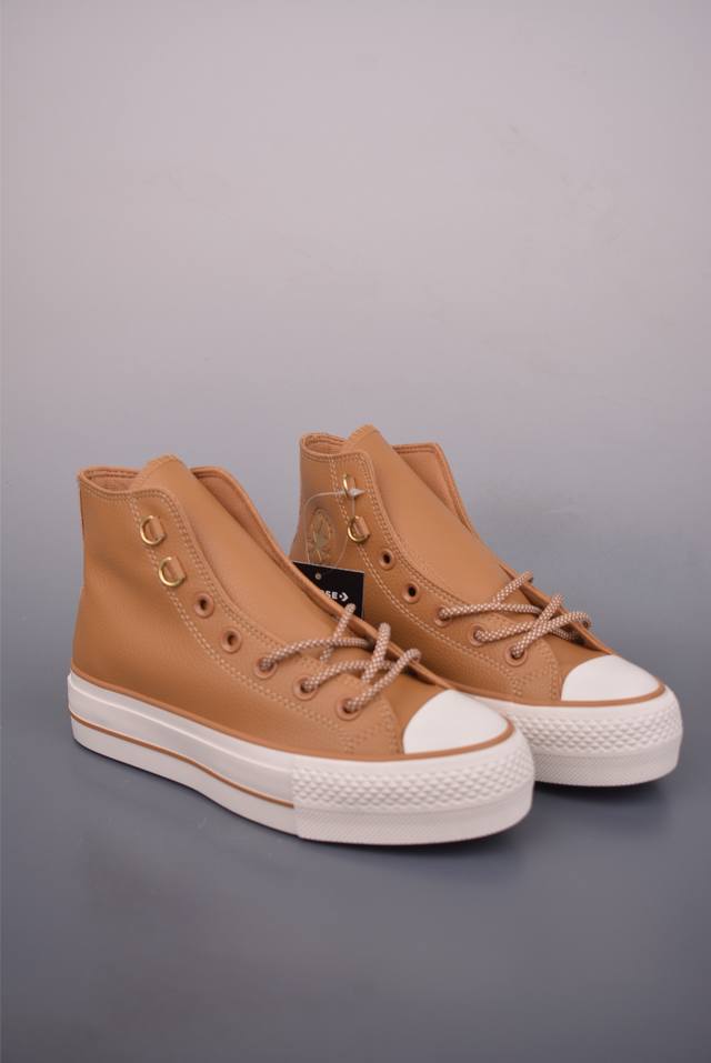 Converse All Star Lift Platform Leather Shoes. The shoe's color scheme creates a
