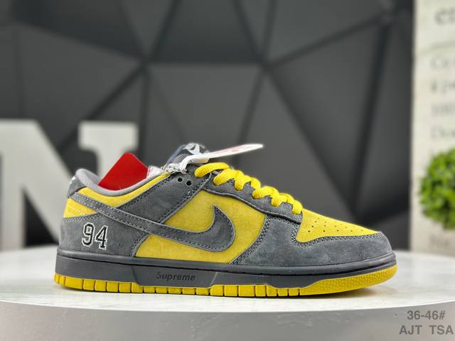 Nike Supreme X Nike Dunk SB Low. This shoe features an embroidered "94" on the