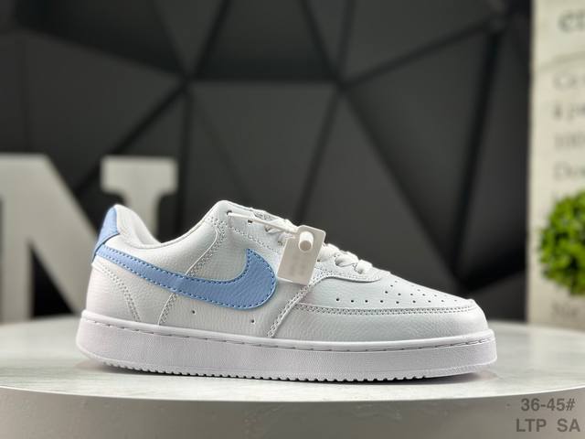 Nike Court Vision Lo Low-Top Sneakers feature a white, blue, and yellow upper.