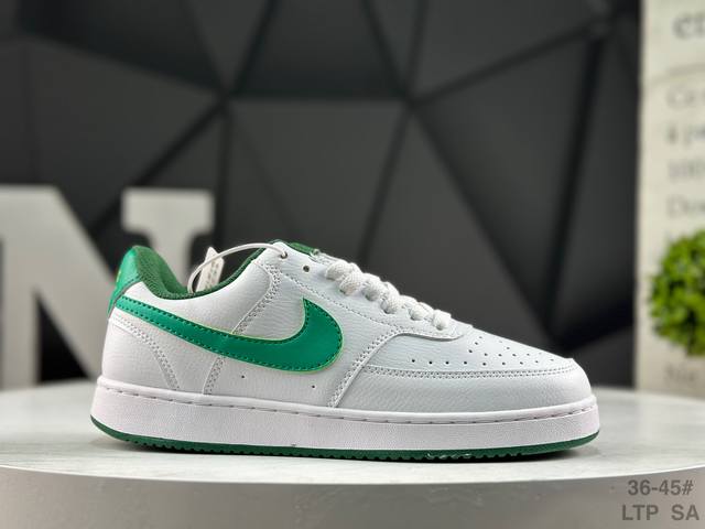 Nike Court Vision Lo Low-Top Sneakers feature a white, blue, and yellow upper.