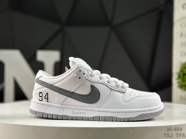 Nike Supreme X Nike Dunk SB Low. This shoe features an embroidered "94" on the