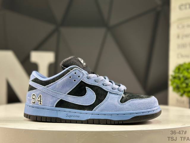 Nike Supreme X Nike Dunk SB Low. This shoe features an embroidered "94" on the