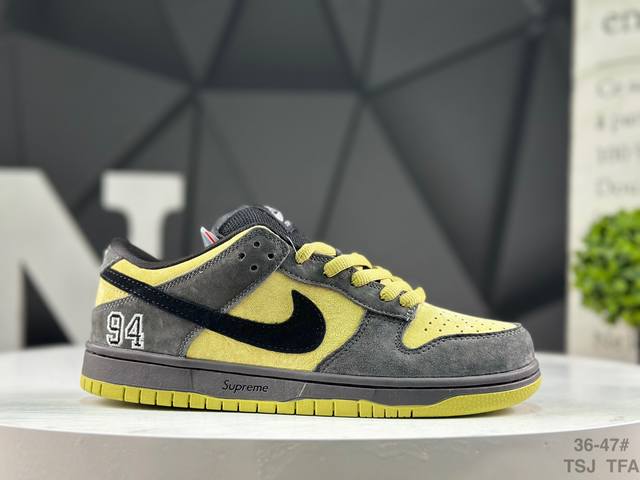 Nike Supreme X Nike Dunk SB Low. This shoe features an embroidered "94" on the