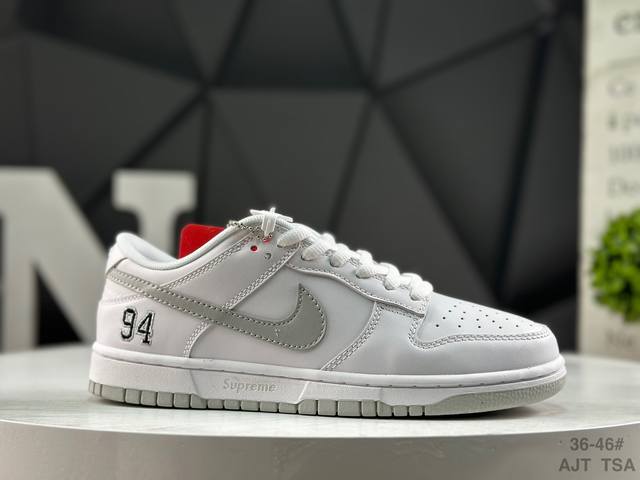 Nike Supreme X Nike Dunk SB Low. This shoe features an embroidered "94" on the