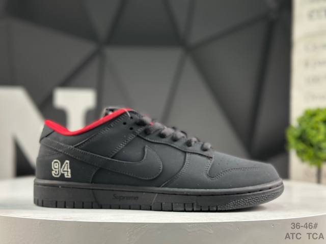 Nike Supreme X Nike Dunk SB Low. This shoe features an embroidered "94" on the