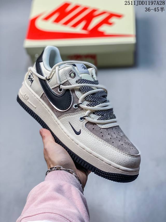 Stuart collaboration, classic brown, white, silver trim, black swoosh, and gold