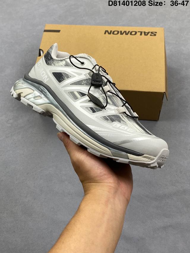 Company-grade Salomon XT-6 outdoor trail running shoes. The upper features Sens